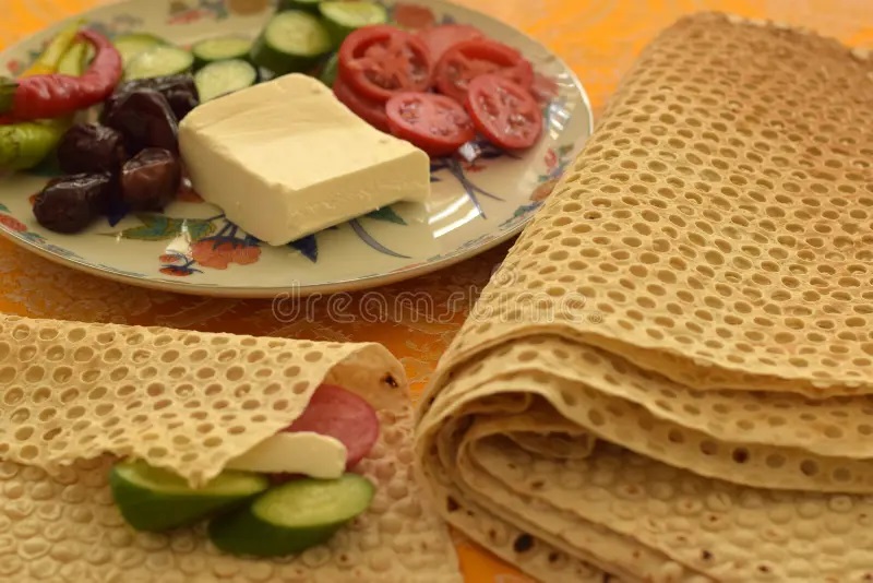 lavash-bread-baked-bakery-machine-iranian-white-flatbread-modern-tandoors-cheese-cucumbers-tomatoes-peppers-132769957